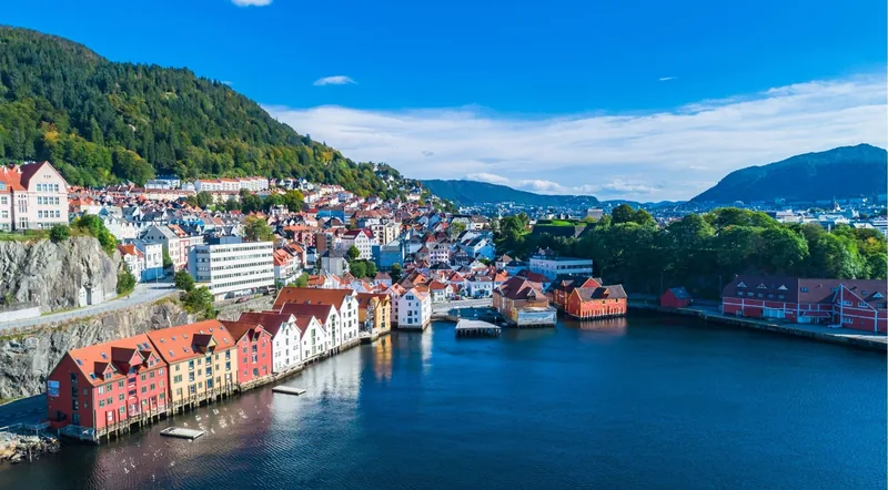 Aerial view of Bergen harbour, waterfront houses and surrounding hills