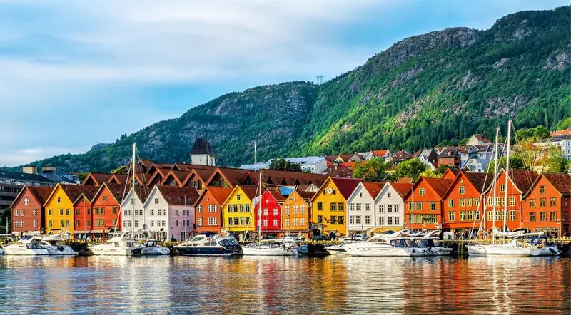 Bergen's colourful Bryggen wharf beside the fjord cruise departure quay